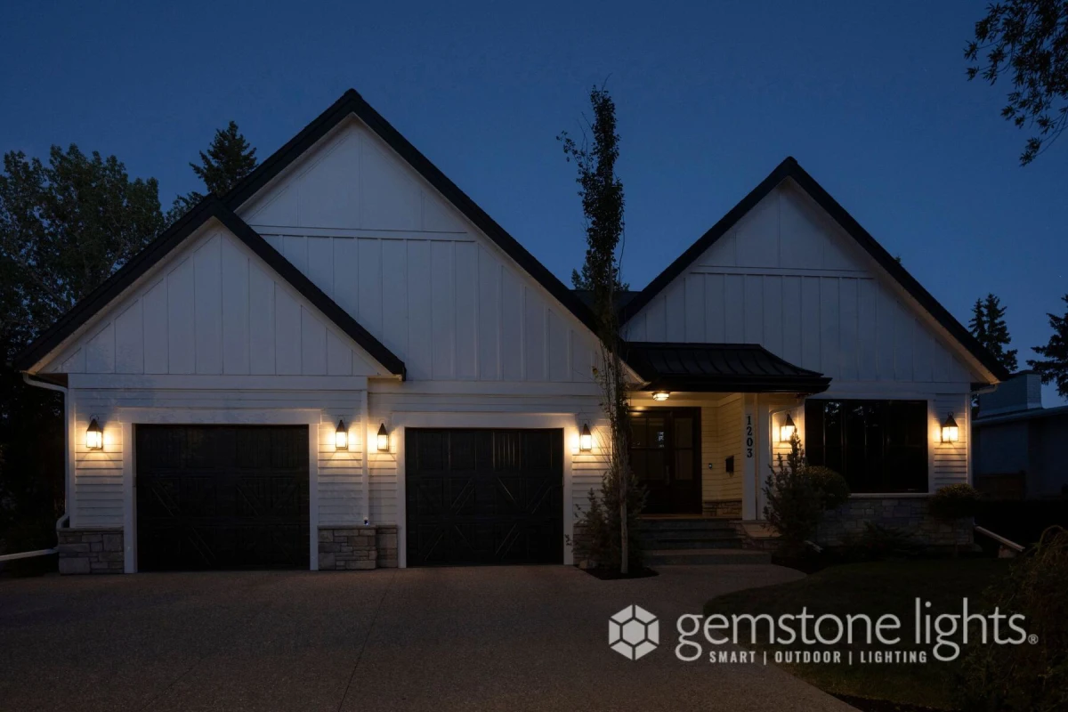The same farmhouse at night with the roofline lights off